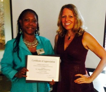 Dr. Gabrielle K. Gabrielli receiving certificate of appreciation from Jennifer Anderson for sponsoring the March SGMP Florida Capital Chapter meeting